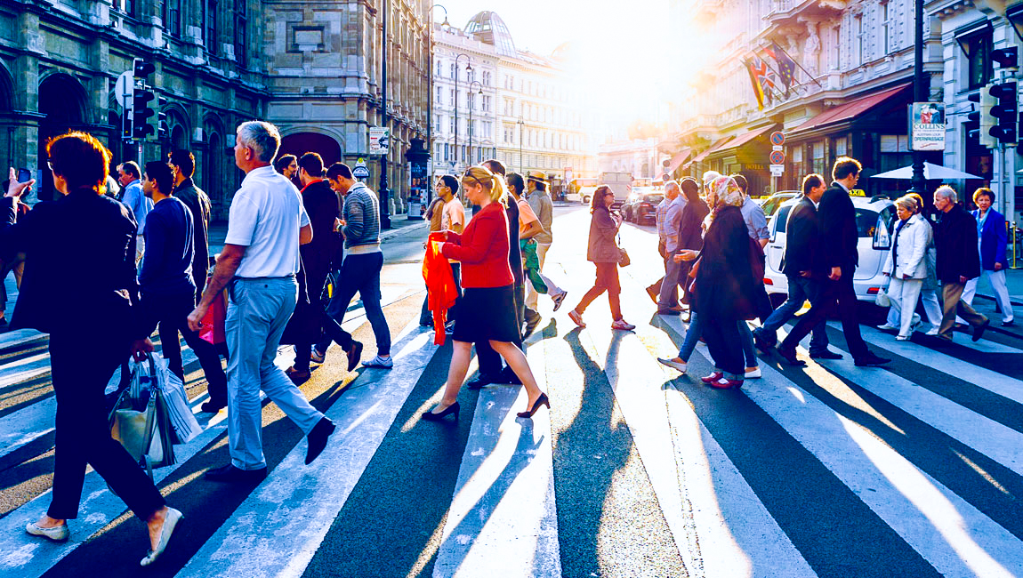 Busy city crosswalk during daytime