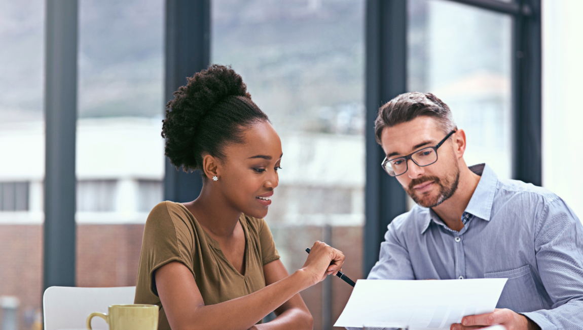 Two colleagues reviewing paperwork