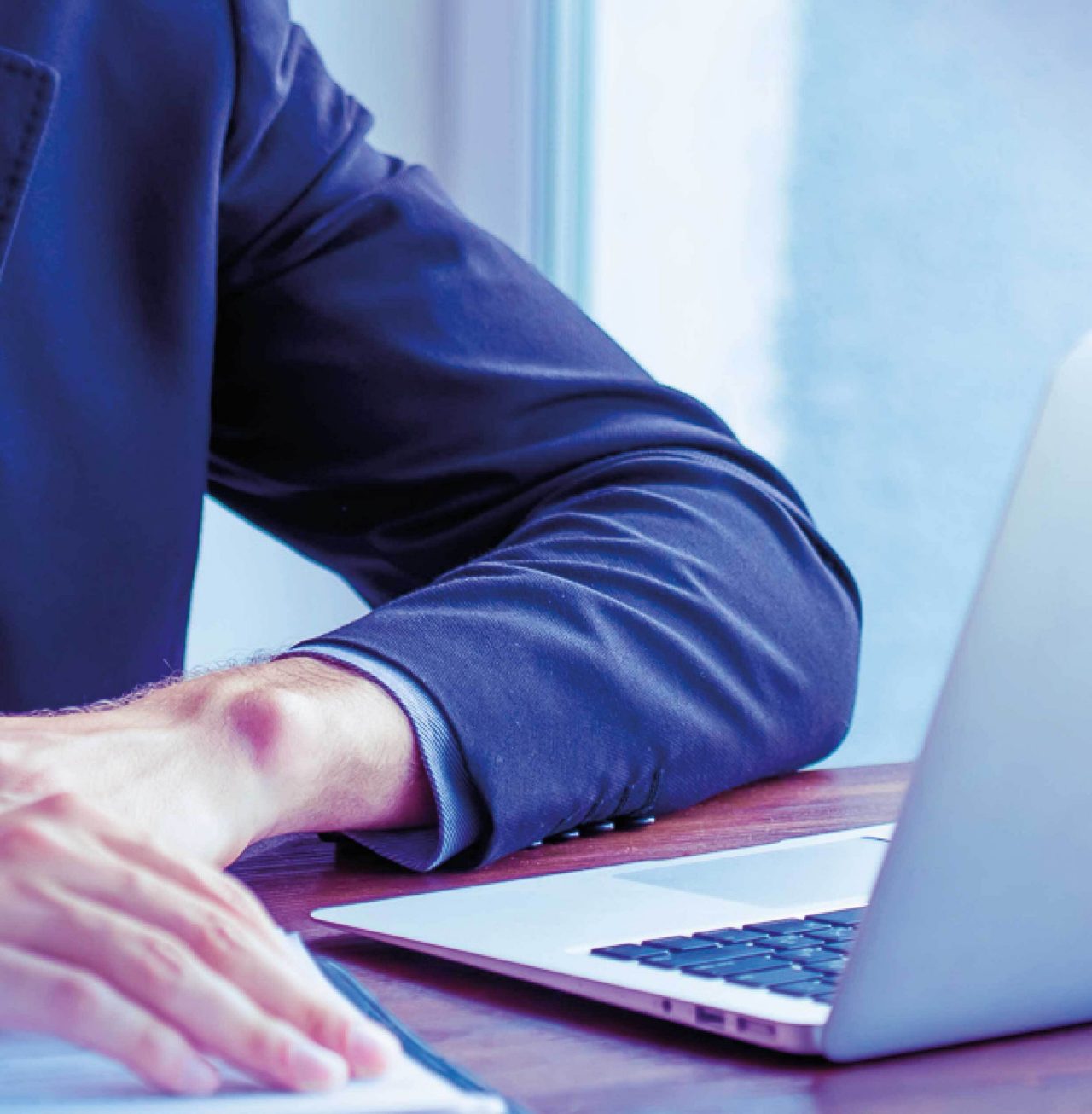 Image mosaic of businessman at laptop