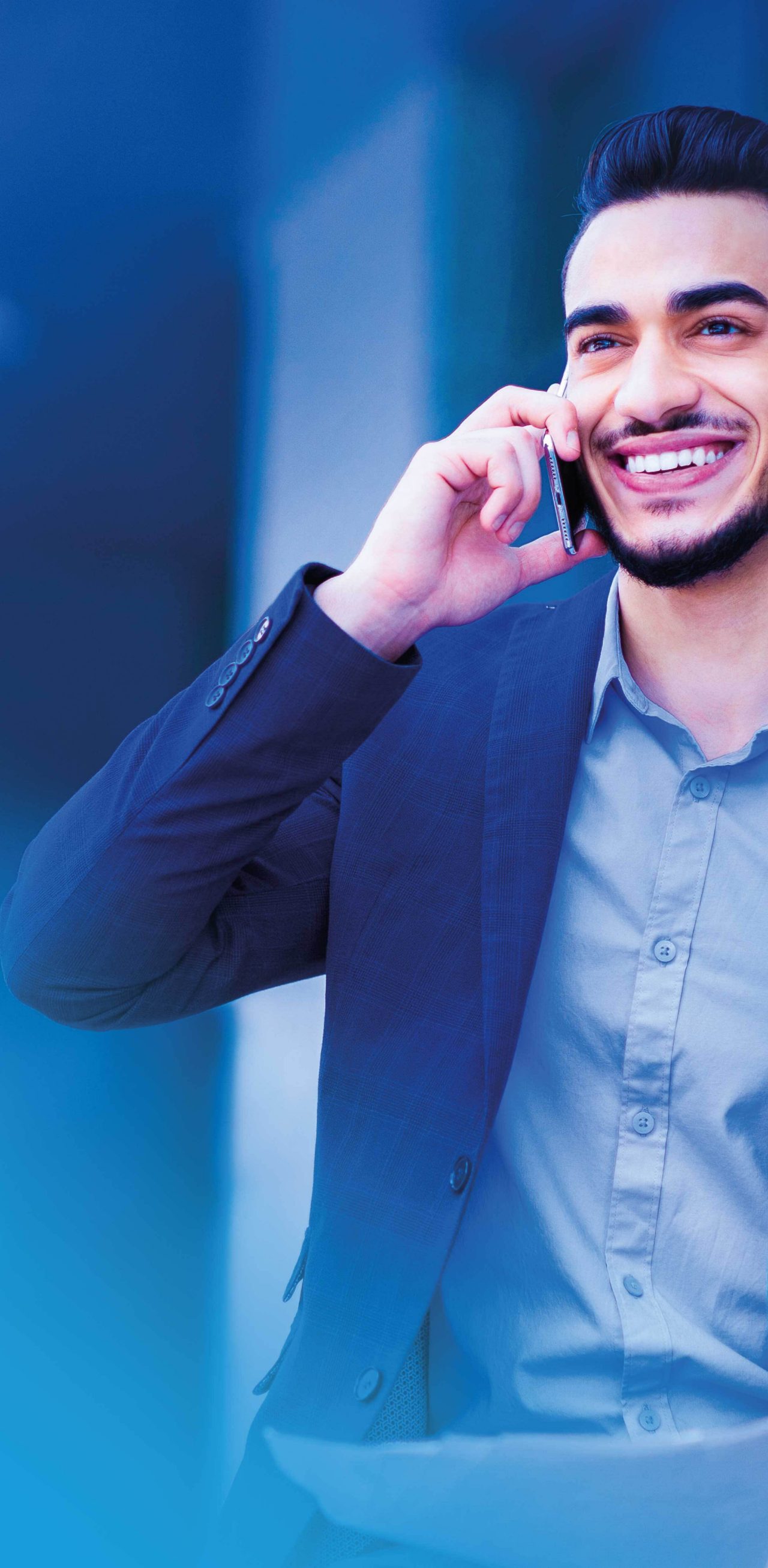 Businessman outside talking on cell phone
