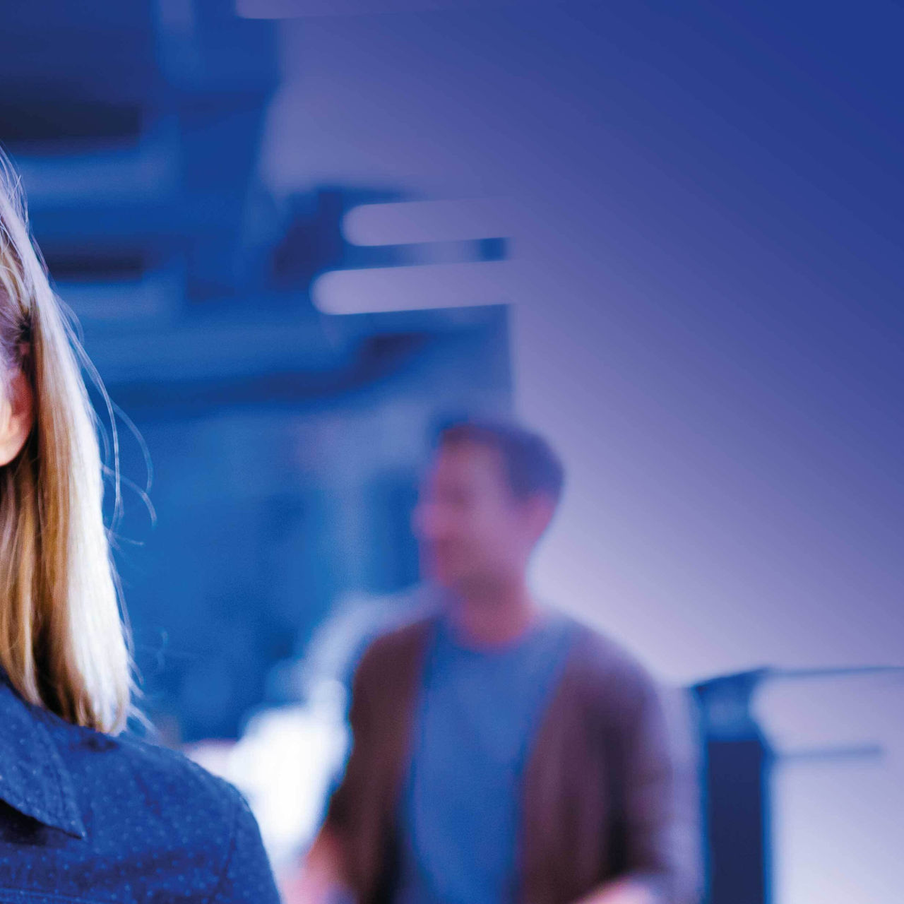 Continuation of smiling businesswoman holding tablet