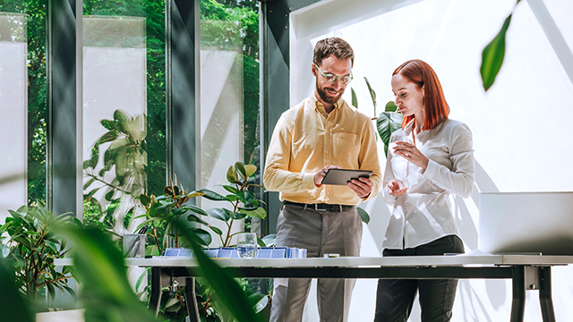 Group of colleagues having meeting in casual office space